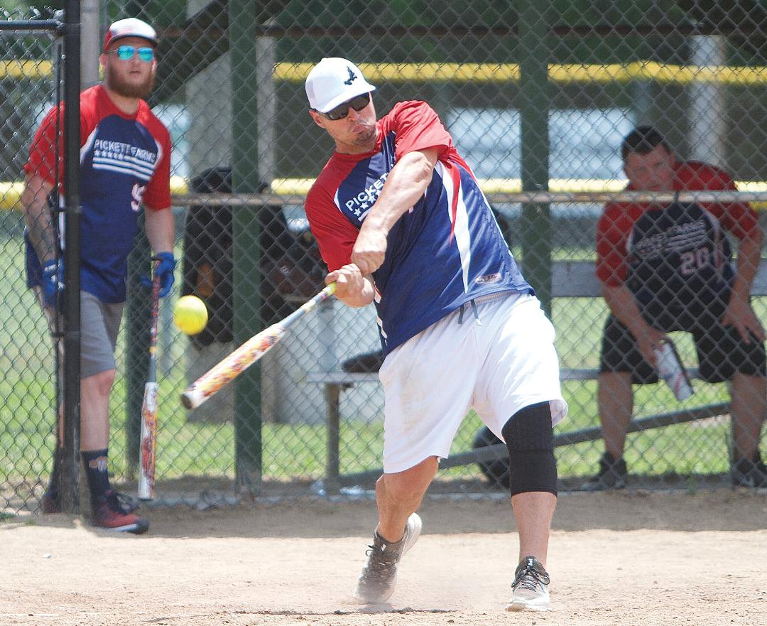 Noah Adams takes a cut for the Pickett Farms softball team during the Strawberry Festival tournament.